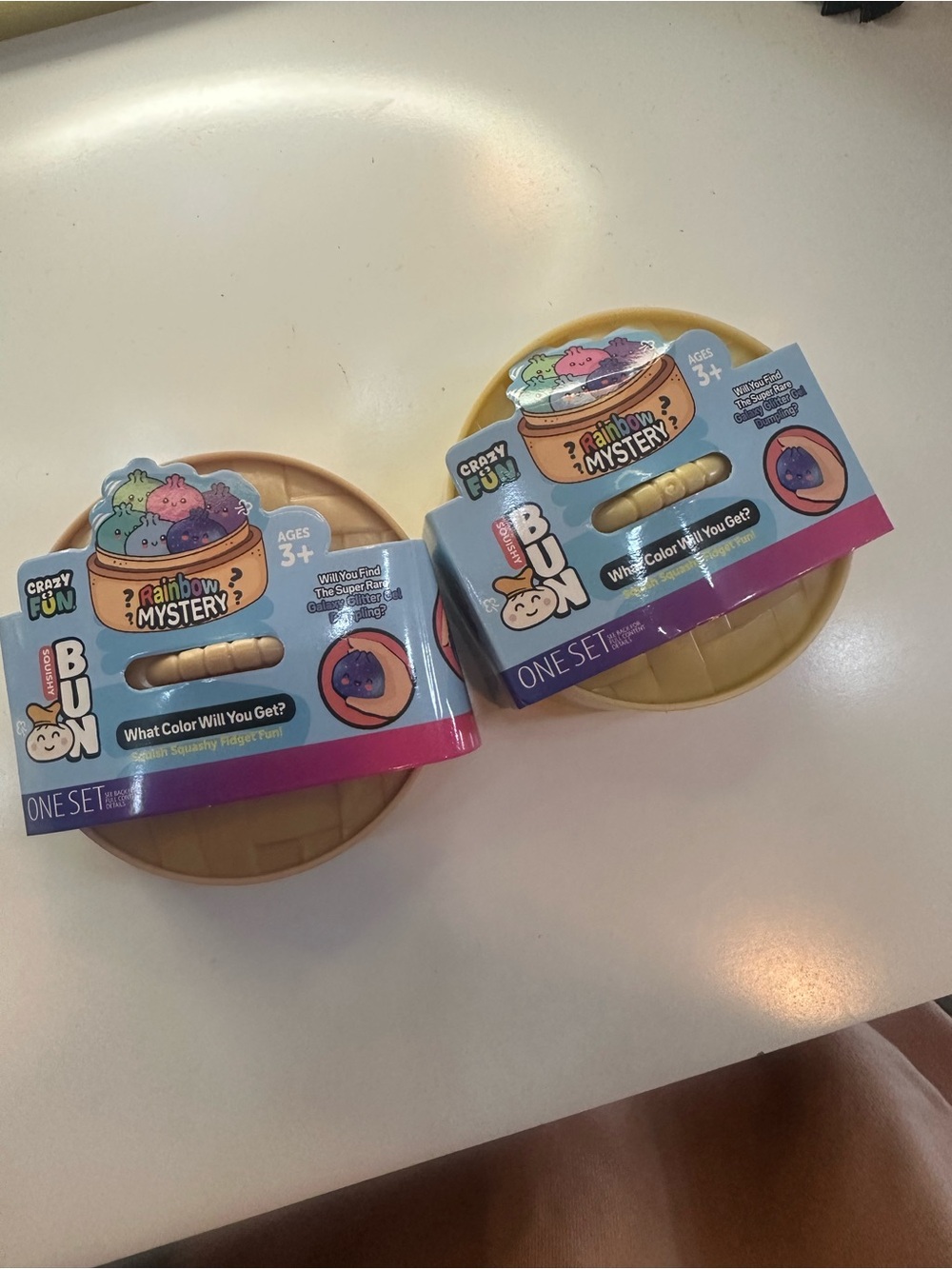 Crazy Bun Rainbow Mystery Squishy Toy - Purple/Blue Packaging